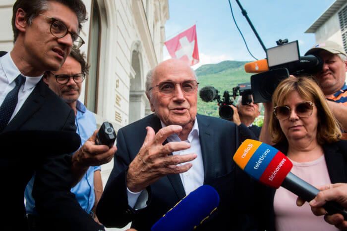 Former FIFA president Sepp Blatter is surrounded by the media as he leaves the Swiss Federal Criminal Court in Bellinzona, Switzerland, Wednesday, June 8, 2022.