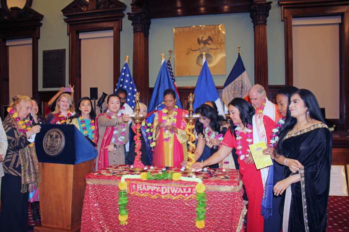 New York City Council Speaker, Adrienne E. Adams (center) and Dr.. Meeta Jain (Democratic District Leader), surrounded by New York City Council members, and honorees, during a lamp lighting ceremony to celebrate Diwali at City Hall.
