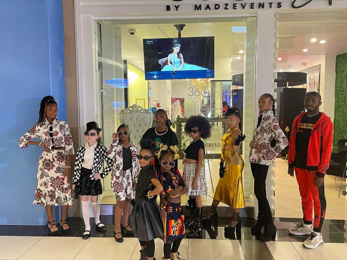 Young models pose in creations by 11-year old fashion designer Amirah Holmes, at Qumara Boutique, Rockland County Fashion Week.