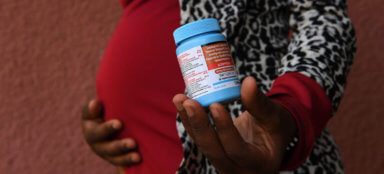 A 20-year-old pregnant woman who was born with HIV, takes medication to prevent mother-to-child transmission.