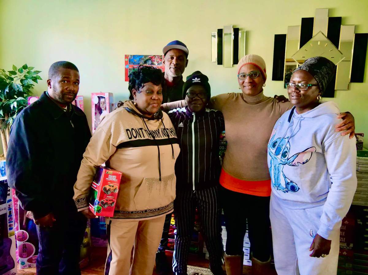 Members of the Guyana Ex-Athletes and Friends Inc., and donors to the toy drive are, Conrad McPherson, Lady Ira Lewis, Burgette Williams, Yvette Faucette, and Deborah Quamina. (backrow) Mr. Springer, of Springer Printers.