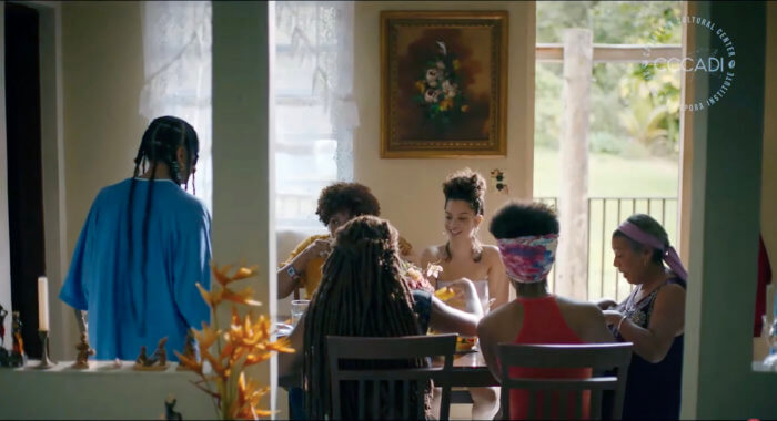 Screen grab of a scene from Alexis Garcia's film "Daughter of the Sea" (2022). Yanise's grandmother is showing her how to prepare a ritual to honor Yemaya, the spiritual goddess in the film. 