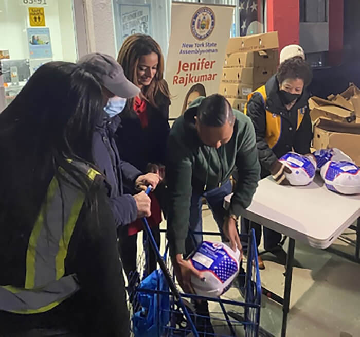Assemblywoman Rajkumar and Zara Charitable Foundation Representatives hand out over 400 Thanksgiving turkeys.