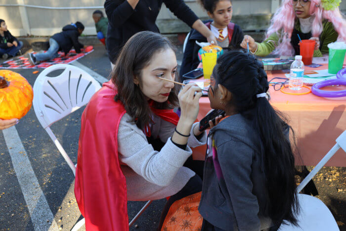 Kids enjoy face painting as part of SQMW's first Fall Harvest Festival to promote civic engagement in Queens.