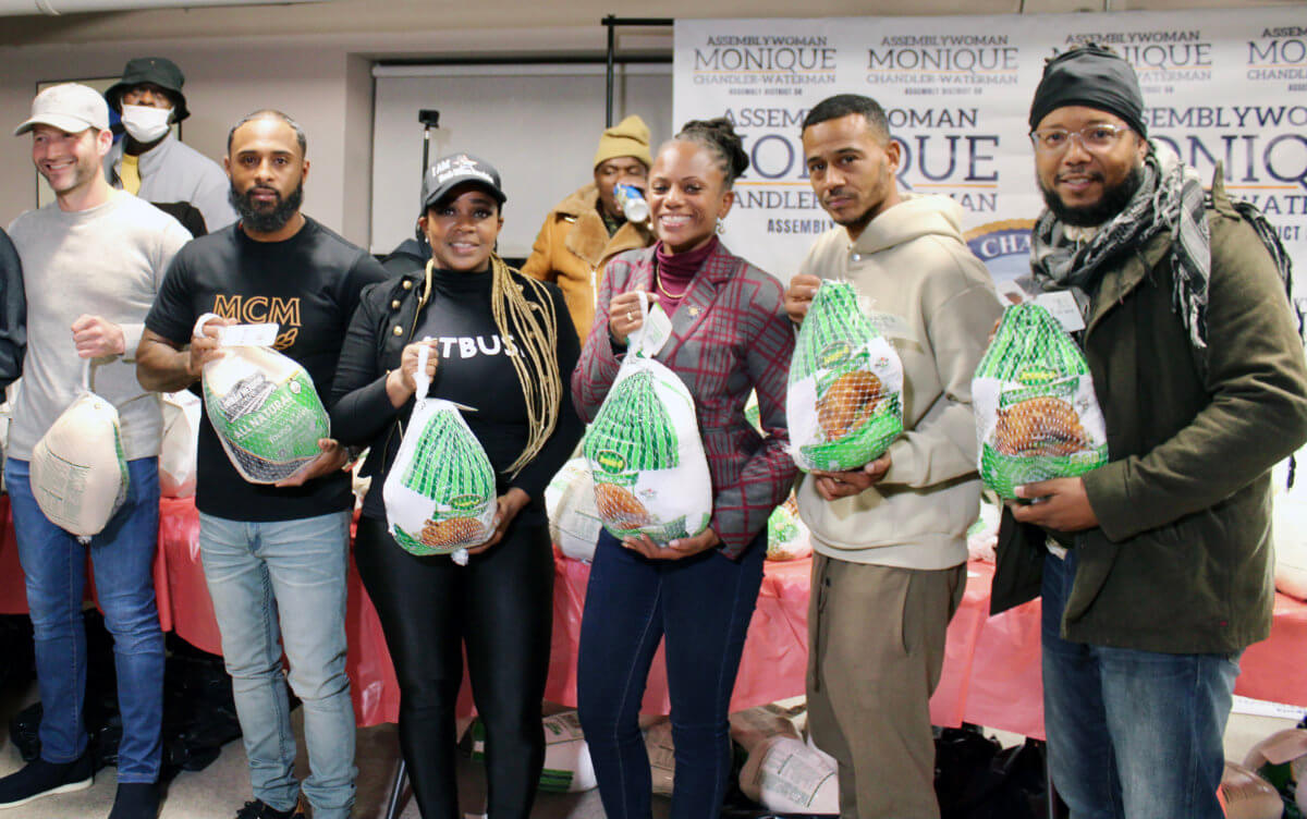 Owner, VP of Clipper Equity, Jacob JJ Bistricer, Domencio Dingle, Dr. Meda Leacock, Assemblywoman Monique Chandler Waterman, Jimmy Cozier, and Gibron Jones, with some of the birds, handed out at the 13th Annual Thanksgiving Turkey Giveaway, at Flatbush Gardens, Brooklyn.