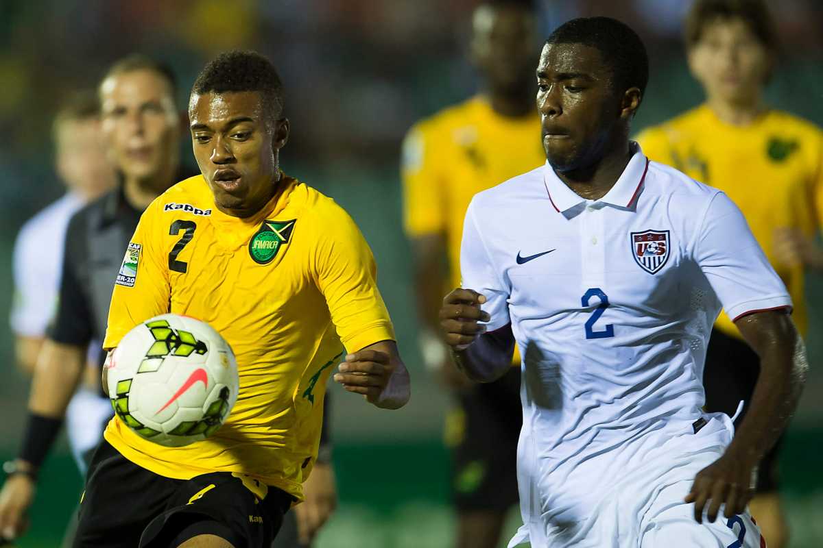 Shaq Moore of the United States and Khalil Stewart of Jamaica at the CONCACAF Under-20 Championship on Jan. 18, 2015 at Stadium, Montego Bay Sports Complex.
