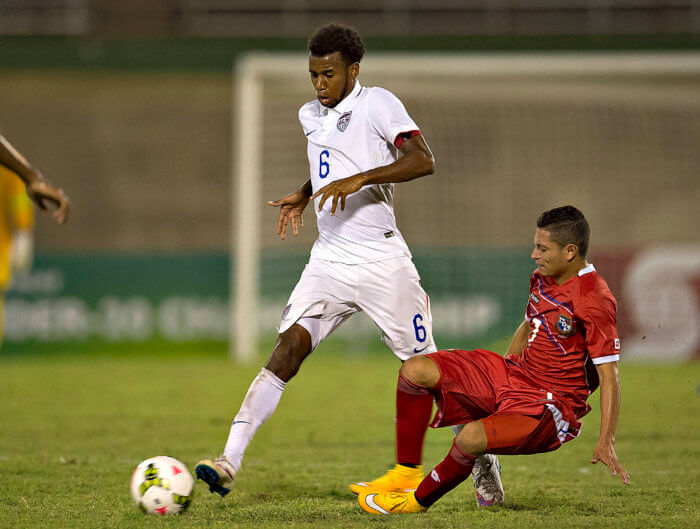 USA's Kellyn Perry-Acosta, left, and Panama's Julian Velarde at the Concacaf Under-20 Championship on Jan. 11, 2015 at Stadium, Independence Park.