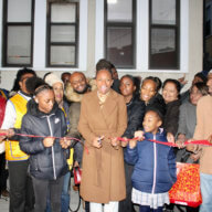 Assemblywoman Monique Chandler-Waterman center, surrounded by family, supporters, and staff, cut the ribbon to officially open her District 58 office.