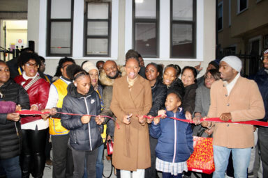 Assemblywoman Monique Chandler-Waterman center, surrounded by family, supporters, and staff, cut the ribbon to officially open her District 58 office.