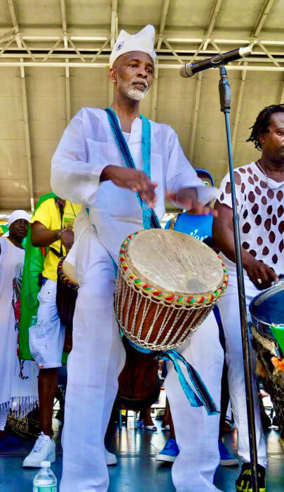 Menes De Griot, an outstanding African drummer and keeper of the culture, who was recently featured in a short film at the African Film Festival, performing at a past event in Brooklyn.