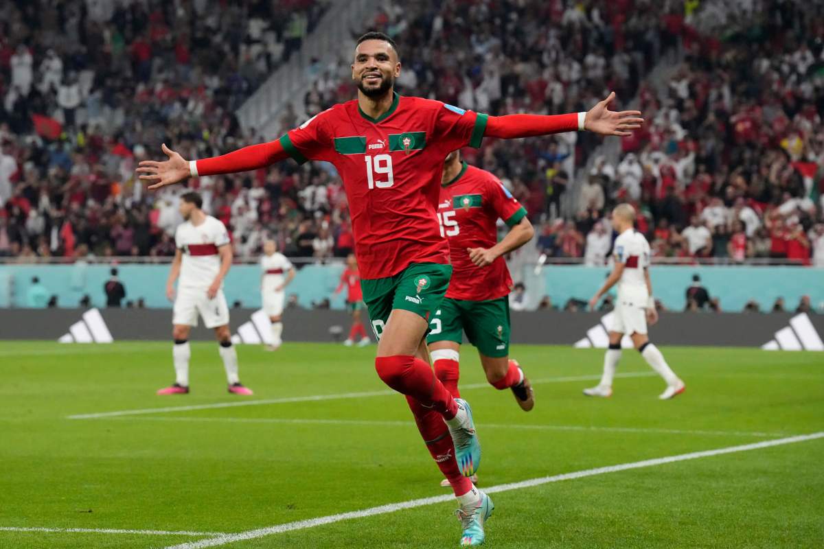 Morocco's Youssef En-Nesyri celebrates after scoring his side's first goal during the World Cup quarterfinal soccer match between Morocco and Portugal, at Al Thumama Stadium in Doha, Qatar, Saturday, Dec. 10, 2022.