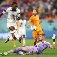 Haji Wright of United States and Andries Noppert of Netherlands compete for the ball during the FIFA World Cup Qatar 2022 Round of 16 match between Netherlands and USA at Khalifa International Stadium on December 03, 2022 in Doha, Qatar.