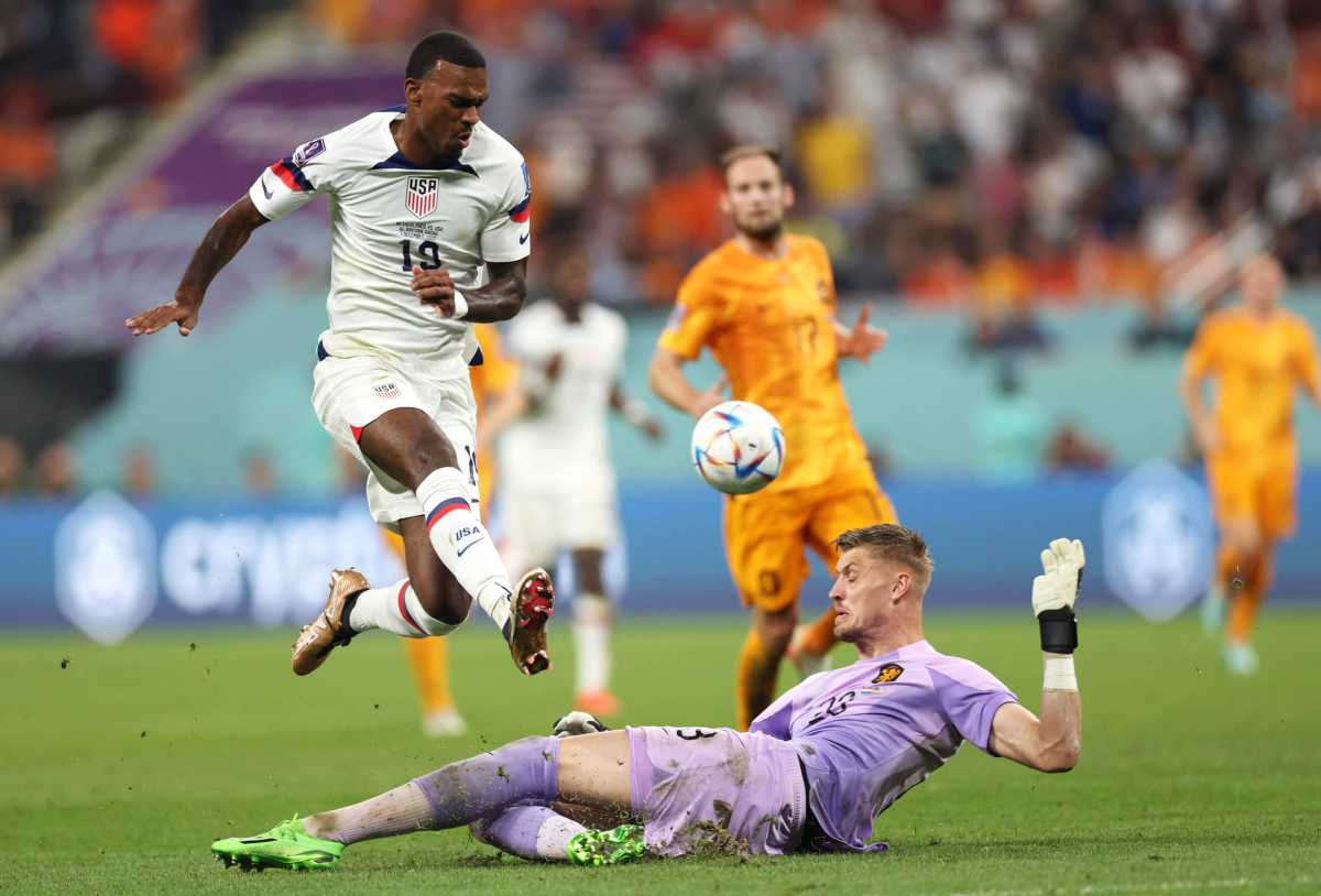 Haji Wright of United States and Andries Noppert of Netherlands compete for the ball during the FIFA World Cup Qatar 2022 Round of 16 match between Netherlands and USA at Khalifa International Stadium on December 03, 2022 in Doha, Qatar.