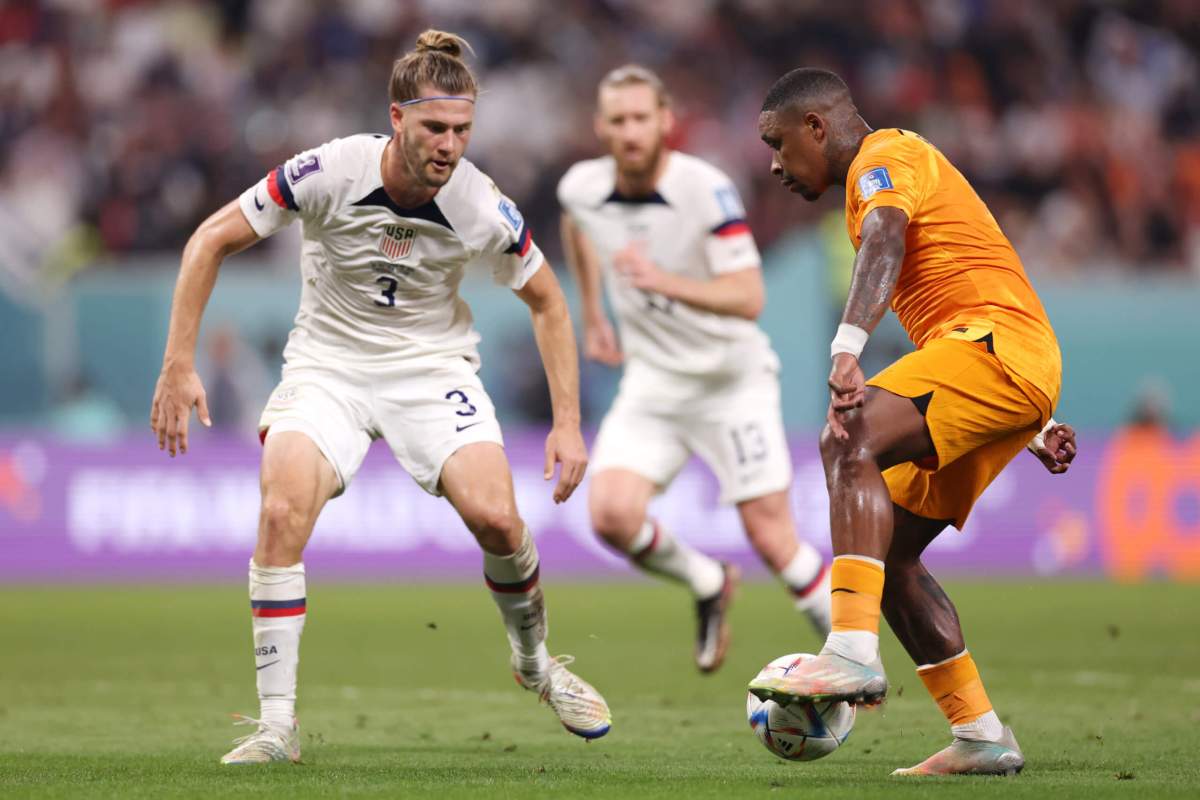 Steven Bergwijn of Netherlands takes on Walker Zimmerman of United States during the FIFA World Cup Qatar 2022 Round of 16 match between Netherlands and USA at Khalifa International Stadium on December 03, 2022 in Doha, Qatar.