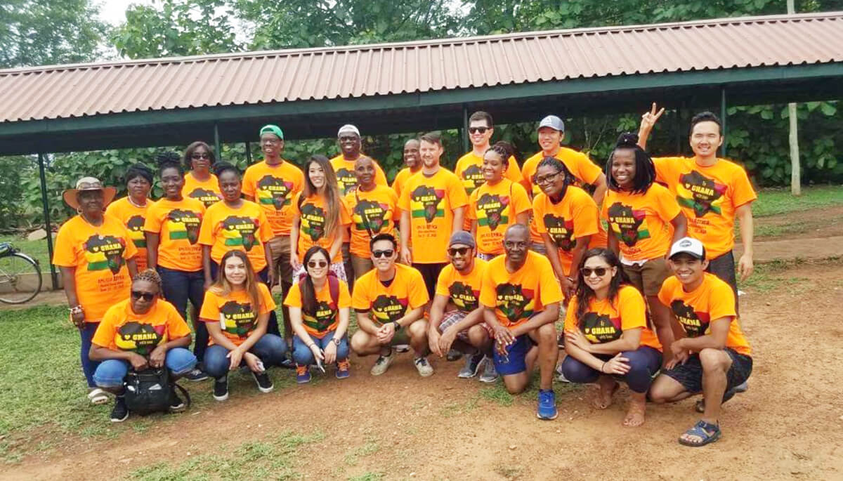 Dr. Janice Emanuel, third from left, standing, photographed with friends, and supporters from around the world. Photo by APC