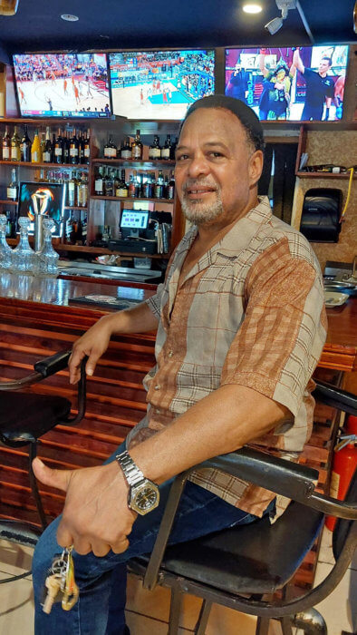 Mark Bendah, who lived in the United States for 43 years, in one of his sports bars at Flavas hotel, restaurant and bar, a multicultural business in Georgetown.