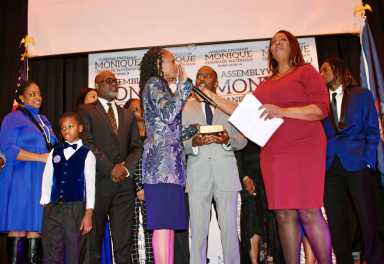 Assemblymember Monique Chandler Waterman was sworn in by Attorney General Letitia James at an inaugural ceremony & gala in Holy Family R.C. Church Annex, Canarsie, surrounded by family and clergy.