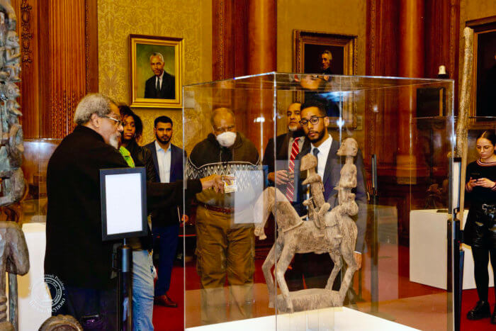 Eric Edwards, founder and executive director of the Cultural Museum of African Art, left, shows BP Antonio Reynoso around the exhibition.