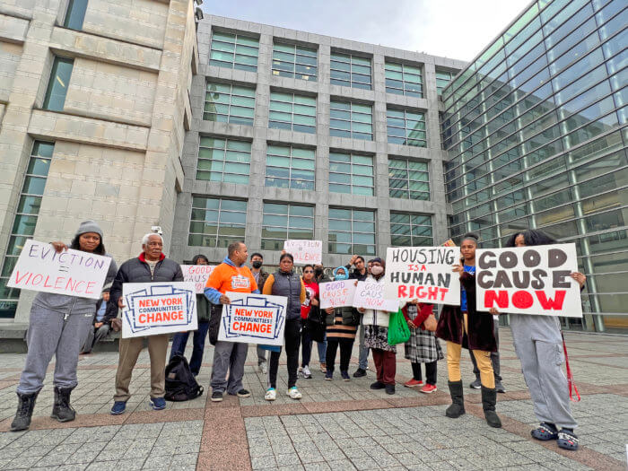 Tenants gather to support a tenant facing eviction after being sexual harassed by her landlord.