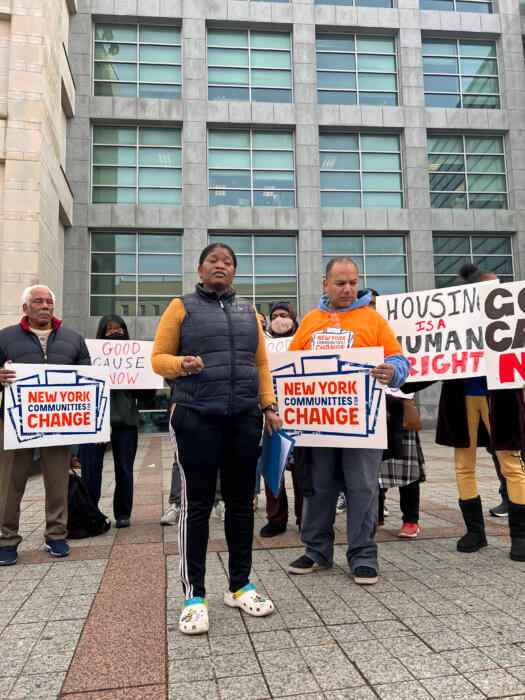 Carlene Hosang, a Queens tenant facing eviction after being sexual harassed by landlord, speaks at a rally to support her court case. 