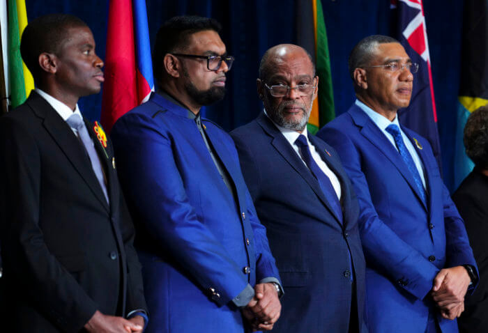 Prime Minister of Grenada Dickon Mitchell, left to right, President of Guyana Irfaan Ali, Prime Minister of Haiti Ariel Henry and Prime Minister of Jamaica Andrew Holness take part in the opening ceremony of the Conference of Heads of Government of the Caribbean Community in Nassau, Bahamas, on Wednesday, Feb. 15, 2023.