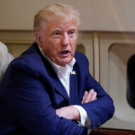 Former President Donald Trump speaks with reporters while in flight on his plane after a campaign rally at Waco Regional Airport, in Waco, Texas, Saturday, March 25, 2023, while en route to West Palm Beach, Fla.