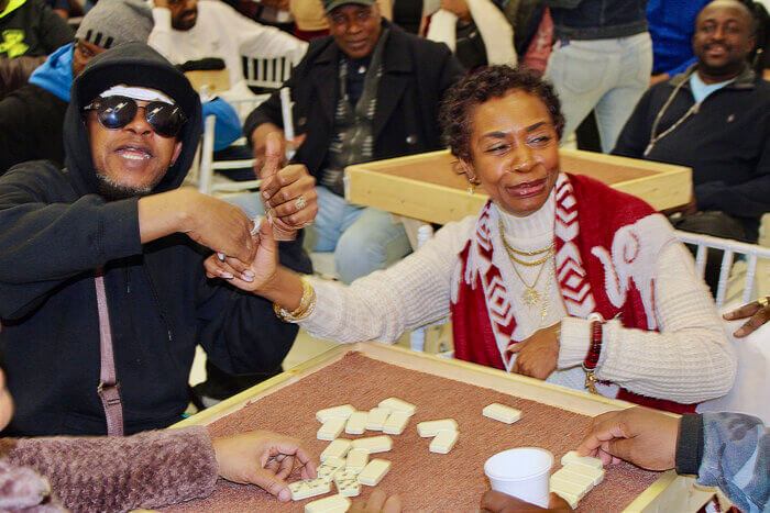 Rep. Yvette D. Clarke shows off her chops at the domino table at the first ever tournament in Brooklyn.