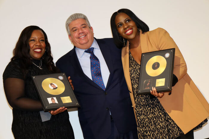 Brooklyn District Attorney Eric Gonzalez with gospel singers Timiney Figueroa (L) and Anaysha Figueroa-Cooper.