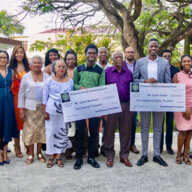 The McGowan family and friends with scholarship recipients, Daniel McAlmont, and Laurel Seales after a handing over reception in Georgetown, Guyana.