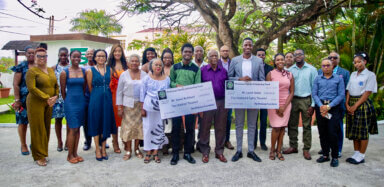 The McGowan family and friends with scholarship recipients, Daniel McAlmont, and Laurel Seales after a handing over reception in Georgetown, Guyana.