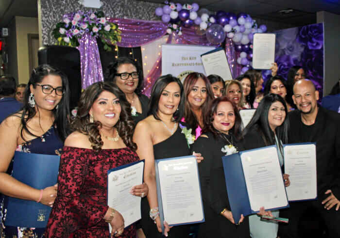 Some of the honorees proudly display one of the citations received with plaques and gifts for their outstanding contributions to the community, at the International Women's Day 2023 Awards, at Code Lounge, Richmond Hill, Queens.