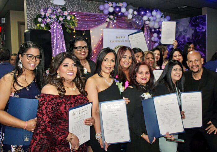 Some of the honorees proudly display one of the citations received with plaques and gifts for their outstanding contributions to the community, at the International Women's Day 2023 Awards, at Code Lounge, Richmond Hill, Queens.