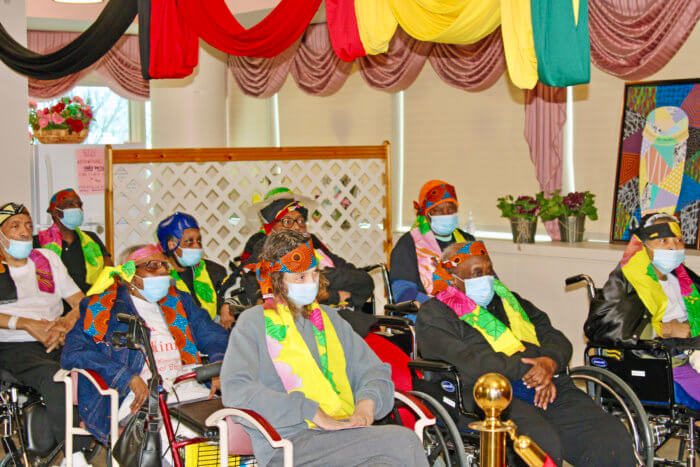 Residents colorfully dressed, enjoy a BHM, and Mckinney's celebration as Best Nursing Home in NYS.