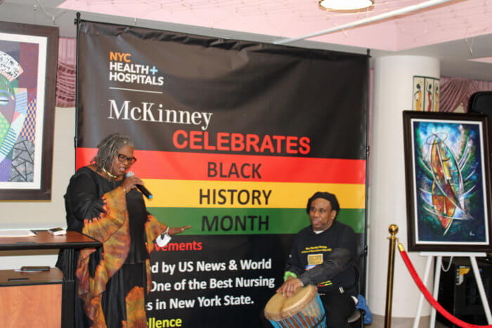 Trinadian-born Angela Cooper, communications director, NYC Health+Hospitals McKinney, performing one of Mirian Makeba's hits with drummer Earl, during a Black History Month, and Mckinney's celebration as Best Nursing Home in NYS.