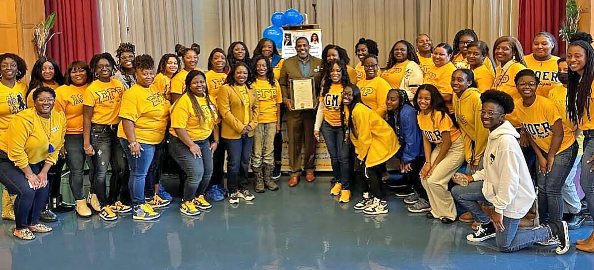 Senate Kevin Parker, center, is surrounded by members of Sigma Gamma Rho Sorority at their recent annual Youth Symposium. 