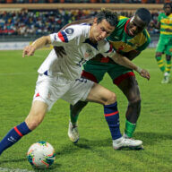 U.S. Brenden Aaronson, left, fights for the ball with Grenada's Benjamin Ettienne, during a CONCACAF Nations League soccer match in Saint George, Grenada, Friday, March 24, 2023.