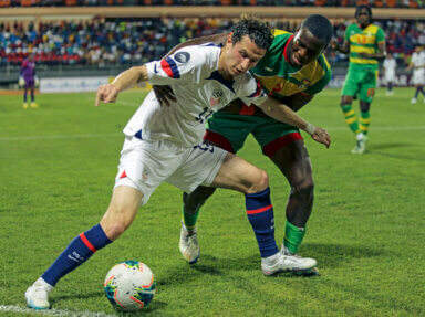 U.S. Brenden Aaronson, left, fights for the ball with Grenada's Benjamin Ettienne, during a CONCACAF Nations League soccer match in Saint George, Grenada, Friday, March 24, 2023.