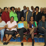 Members of the SVG Relief USA, Inc. display plaques from Minister Dr. Orando L. Brewster.