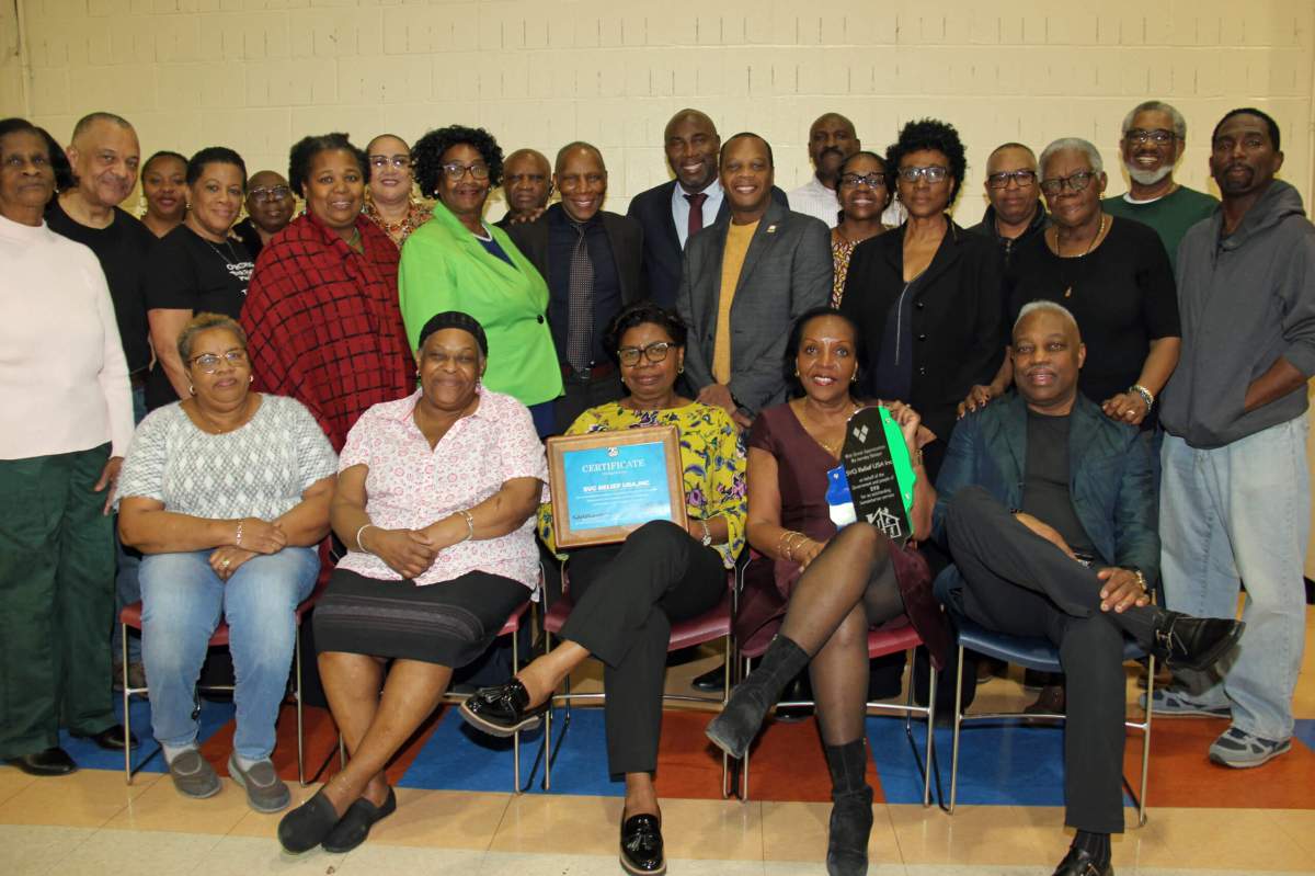 Members of the SVG Relief USA, Inc. display plaques from Minister Dr. Orando L. Brewster.