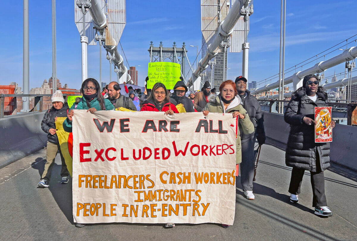 Excluded workers march over the Manhattan Bridge calling for the Unemployment Bridge Program.