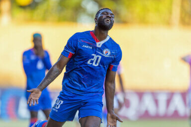 SAN CRISTOBAL, REPUBLICA DOMINICANA. MARCH 28th: Frantzdy Pierrot #20 of Haiti claiming during the League B - Group B match between Haiti and Bermuda in the 2022/23 Concacaf Nations League, held at the Panamericano Stadium, in San Cristobal, Republica Dominicana.