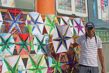 Ryan Naar, the youngest kitemaker on the Camp Street block is passing on the kite making skill to his nephews, and is hopeful that all his kites will be sold before the Easter April 8-10 weekend.