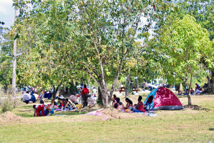 Easter celebrants picnic in the Botanical Gardens, Guyana, as outdoor gatherings return, post-pandemic.