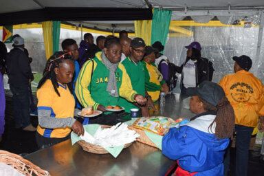 Jamaican athletes get meal at Team Jamaica Bickle Tent.