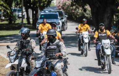 Police escort a FIFA delegation as part of a global tour ahead of the Women’s World Cup, in Port-au-Prince, Haiti, Saturday, April 15, 2023. The delegation is scheduled to travel with the iconic trophy to all 32 participating nations of the soccer tournament which kicks off on July 20, co-hosted by Australia and New Zealand.