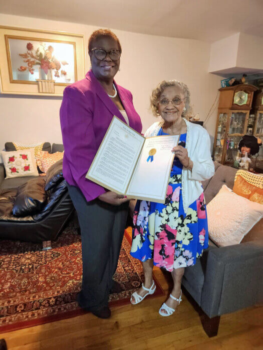 Sen. Roxannne Persaud (left) and Doris Fordyce with proclamation.