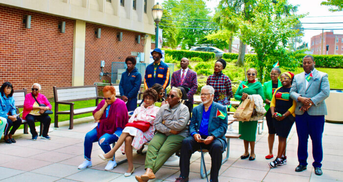 Expatriates enjoying the celebration to honor Guyana’s flag raising on Dorothy L Goosby Plaza at Hempstead Town Hall. 