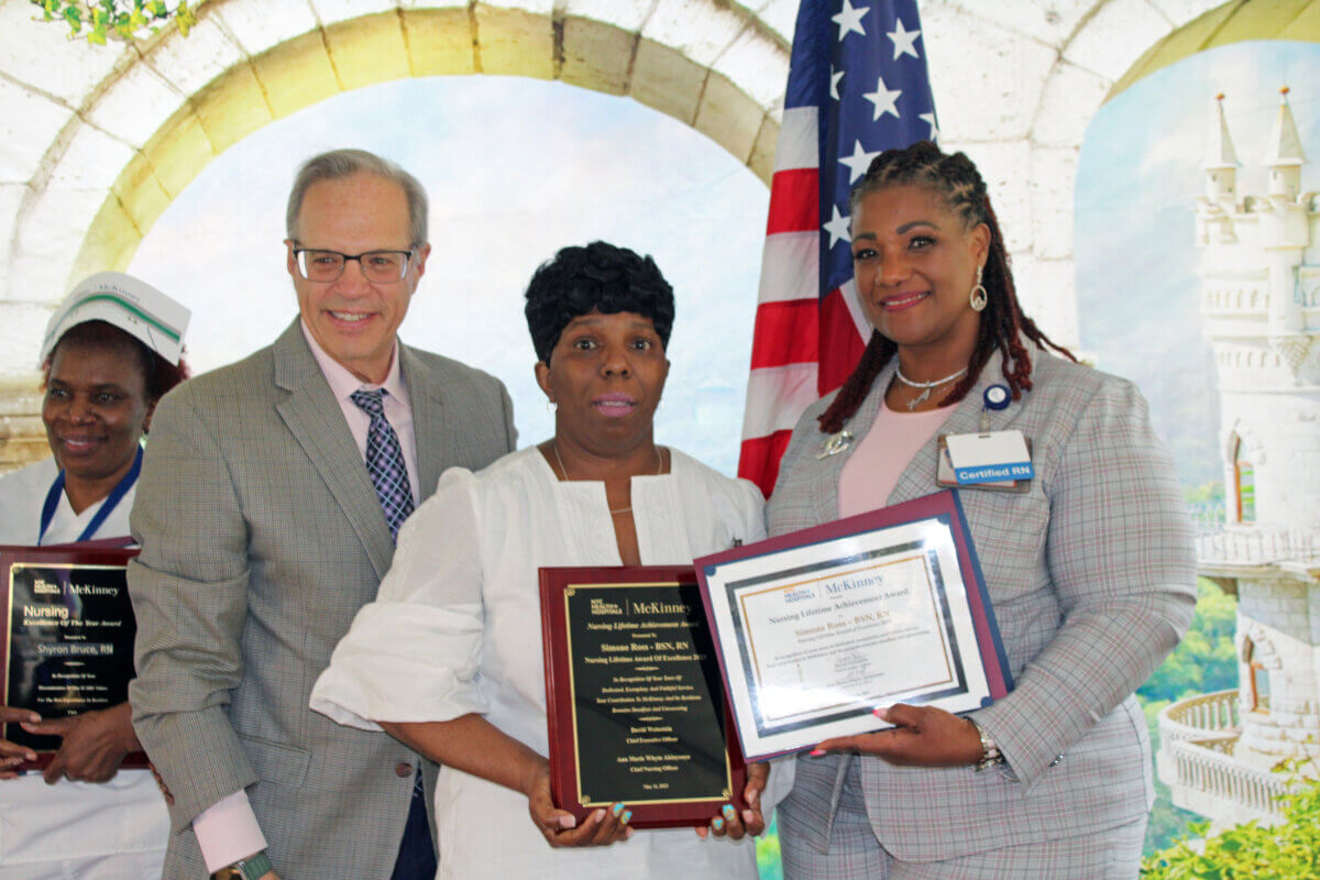 David Weinstein, chief executive officer, Nursing Lifetime of Excellence, recipient, Simone Ross, RN, and Ann Whyte Akinyooye, chief nursing officer, during the National Nursing Award Ceremony.