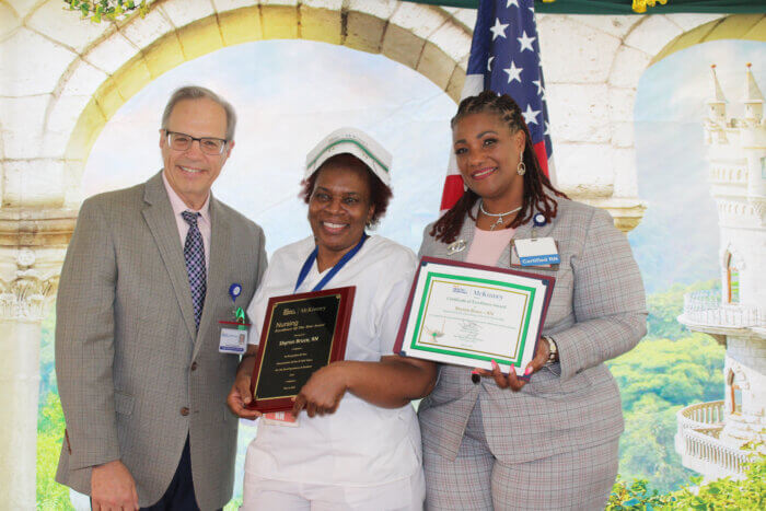 David Weinstein, chief executive officer, Nursing Excellence of the Year recipient, Sharon Bruce, RN, and Ann Whyte Akinyooye, chief nursing officer,  during the National Nursing Award Ceremony.