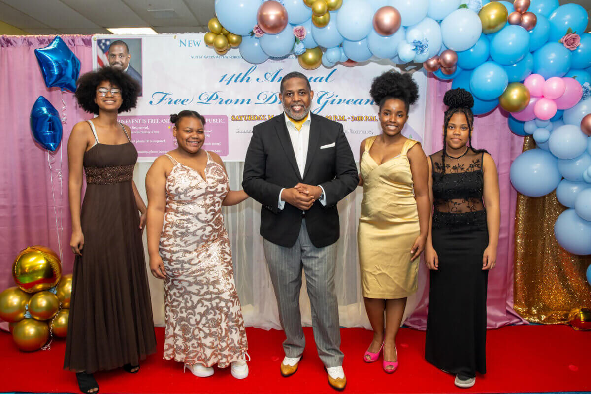 Graduating students strike a pose with Senator Kevin Parker, center after picking out their pretty Prom dresses, shoes and accessories.